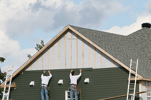 Professional Siding Contractor technician working in East Meadow, NY